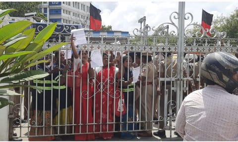 NULM workers are waiting outside the Ripon building gate to submit their petitions on Thursday