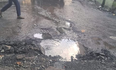 Dirty water spilling onto the Bharathipuram Main Road