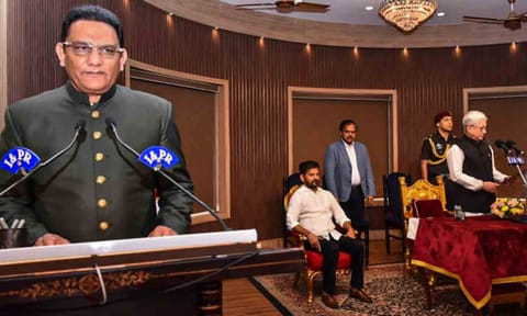 &nbsp;Telangana Governor Jishnu Dev Verma congratulates Congress leader and former cricketer Mohammad Azharuddin after the latter took oath as a state minister during a swearing-in ceremony, at Raj Bhavan, in Hyderabad. Chief Minister A Revanth Reddy is also seen (PTI)&nbsp;