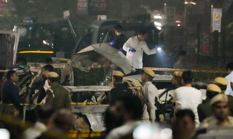 Forensic team investigating the spot after the blast occurred in a parked car near Red Fort, leaving multiple vehicles in flames, in New Delhi, Monday, Nov. 10, 2025. At least eight people were killed, and 24 others suffered injuries in the incident 