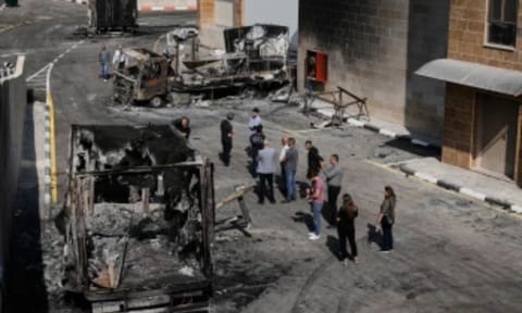 Dozens of masked Israeli settlers attacked a pair of Palestinian villages in the occupied West Bank on Tuesday, setting fire to vehicles and other property before clashing with Israeli soldiers sent to halt the rampage. (Photo: AP)
