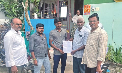 Booth level Officer (BLO) distributing the SIR forms.&nbsp;