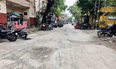 Loose gravel and worn-off patches on a portion of GKM Colony road