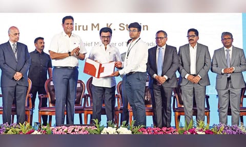 Chief Minister MK Stalin handing over an appointment order to a recruit at the TN Rising conclave in Coimbatore on Tuesday
