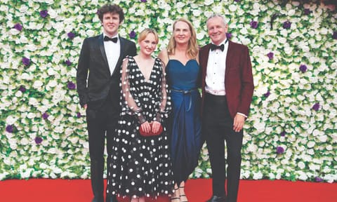 Natasha Conlon (navy blue dress) with her family