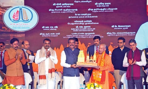 Union Minister Dharmendra Pradhan presents a memento to UP Chief Minister Yogi Adityanath at the inaugural ceremony&nbsp;
