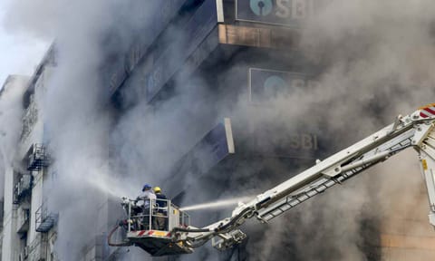 Firefighters try to douse a fire that broke out at Swagota Square, Sohum Emporia, in Guwahati, Wednesday, Dec. 10, 2025 (PTI)&nbsp;