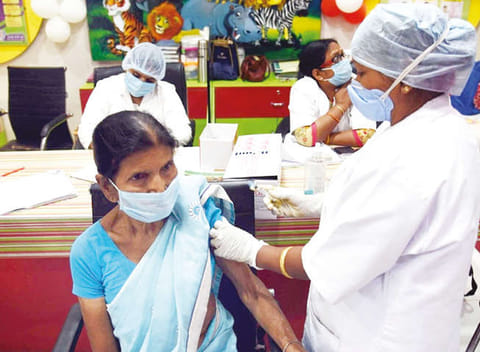 A senior citizen getting a vaccine shot