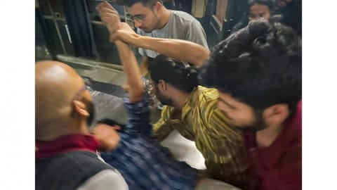 Students tend to a peer who was hurt in the clash