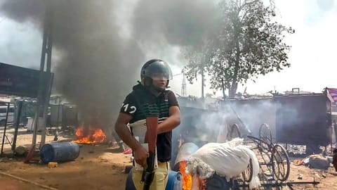 A policeman at the site after a communal clash during the Ram Navami procession, in Himmatnagar