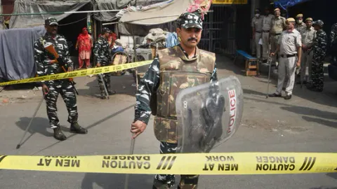Security personnel keep vigil after clashes broke out between two communities during a Hanuman Jayanti procession