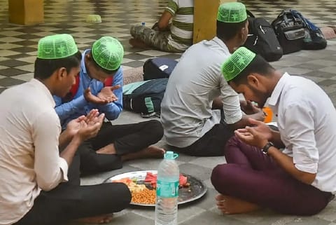 Muslims offer prayers before breaking their day long fast during holy month of Ramadan, at a Mosque