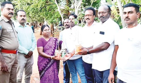 Mahendran (extreme right) handing over the saplings to Thaneer organisation in Tiruchy on Tuesday