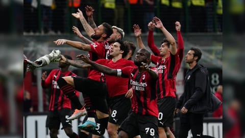 AC Milan players celebrating.