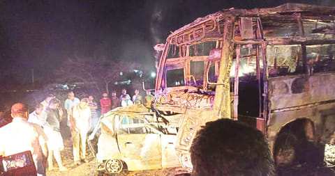 The mangled remains of the burnt car and mini-bus in Tirupur district on Saturday