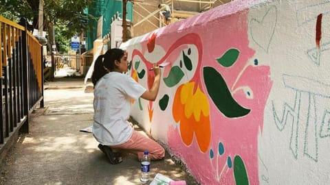 Navya Naveli Nanda painting a wall