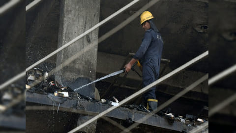 Firefighter douses fire at 4-storey building