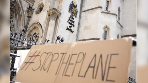 A placard left outside the High Court