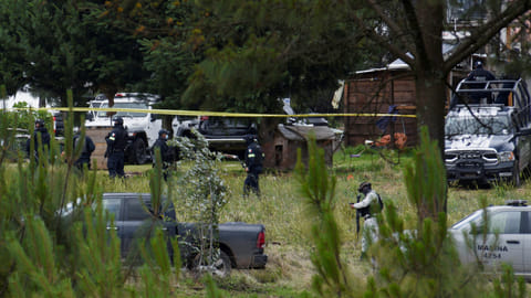 Federal forces are pictured at a scene following a shootout