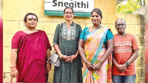 Malaika (second from left) with members of Snegithi