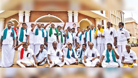 Farmers with black badges demonstrate outside the Collectorate in Thanjavur on Friday
