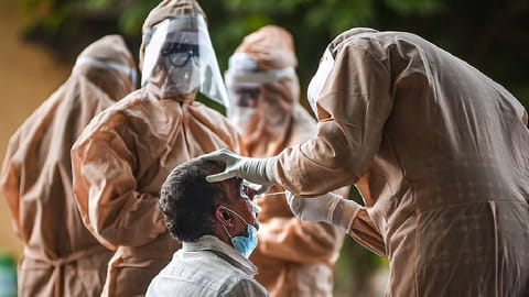 Medics collect a swab sample for Covid-19.