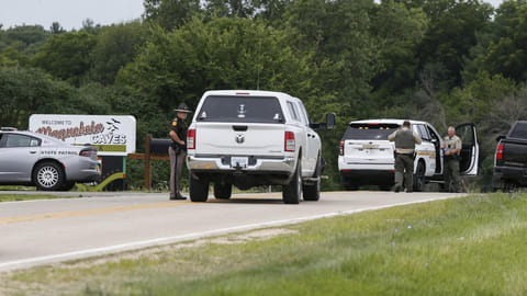 Police investigating a shooting at the entrance of Maquoketa Caves State Park