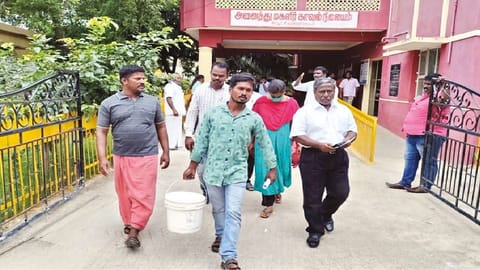 Kamanuthattu hamlet residents coming out of Ambur taluk police station after filing a complaint