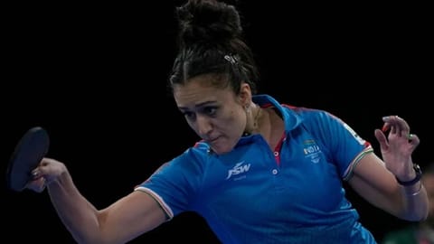India's Manika Batra competes against South Africa's Musfiquh Kalam during the women's team table tennis competition Commonwealth Games in Birmingham, England