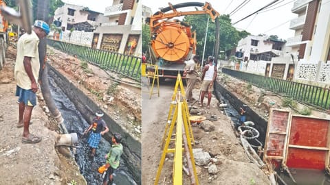 Workers removing sewage at Millers Road