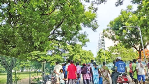 Passersby stopping to watch the Chennai Open