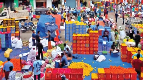 Flowers arriving at wholesale market in Thovalai Kanniyakumari district on Tuesday