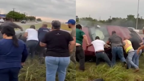 People rescuing driver from car crash
