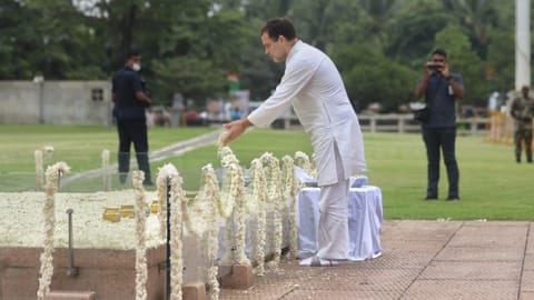 Congress leader Rahul Gandhi pays  floral tribute at his father's memorial in Sriperumbudur.