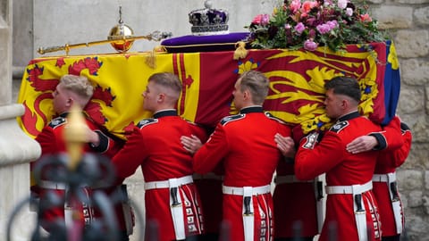 The wreath contains foliage of Rosemary, English Oak, and Myrtle and flowers