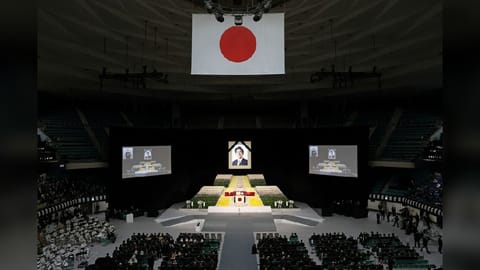 A portrait of Shinzo Abe hangs above the stage during the state funeral for Japan's former prime minister Shinzo Abe