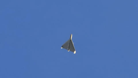 A drone is seen in the sky seconds before it fired