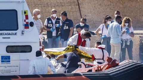 Bodies are disembarked on the tiny Sicilian island of Lampedusa, Italy, Oct. 21, 2022. More than 29,000 migrants have died trying to reach Europe since 2014, with 5,000 deaths in the last two years, the International Organization for Migration said in a report.