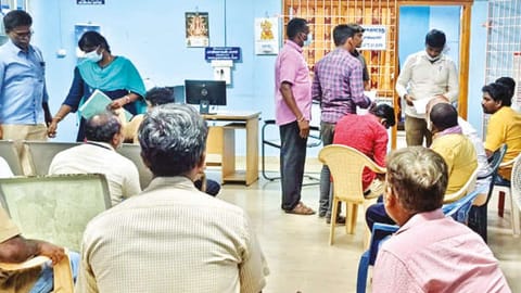 A DVAC team searching the RTO office in Paranur on Friday