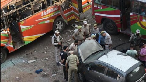 Police inspect the site of one of the explosions