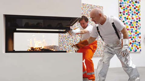 The Turner prize winner and assistants used tongs to deposit individual pieces stacked in piles into fireplaces in the gallery
