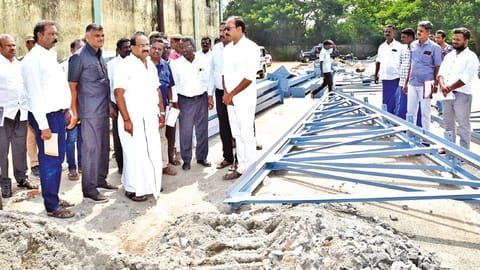 Food Minister R Sakkarapani inspecting ongoing construction of semi-godowns at TNCSC premises in Tiruvarur on Thursday