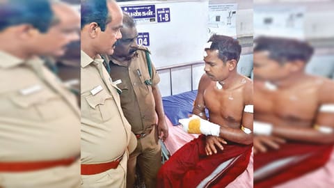 Forest officials enquiring injured anti-poaching watcher Bomman at hospital on Wednesday
