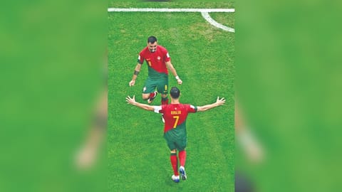 Portugal's Cristiano Ronaldo celebrates his team's first goal with team-mate Bruno Fernandes