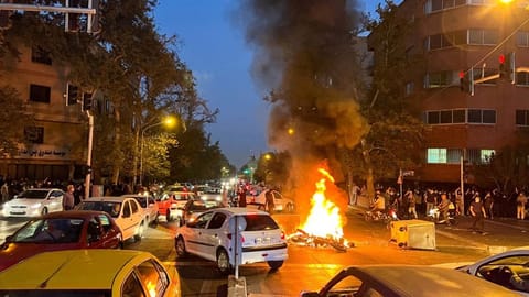 A police motorcycle burned during protests