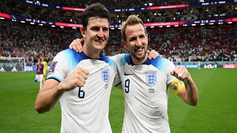 Harry Maguire, Harry Kane posing after the win