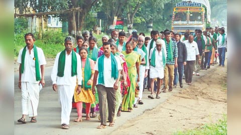 Annur farmers taking out a protest march to Coimbatore on Monday.