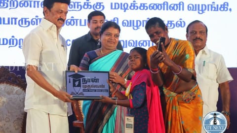 Stalin handing over laptop to a disabled person under the Naan Mudhalvan scheme.