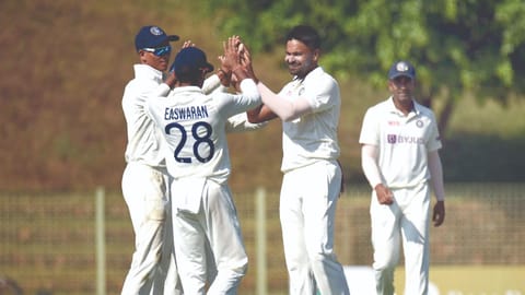 India A players celebrate the fall of a wicket
