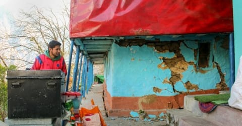 A resident shows cracks that appeared in a house in Joshimath